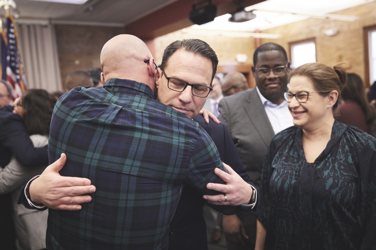 Josh Shapiro hugs an attendee who was impacted by the criminal legal system at the press conference calling for the abolition of the death penalty 