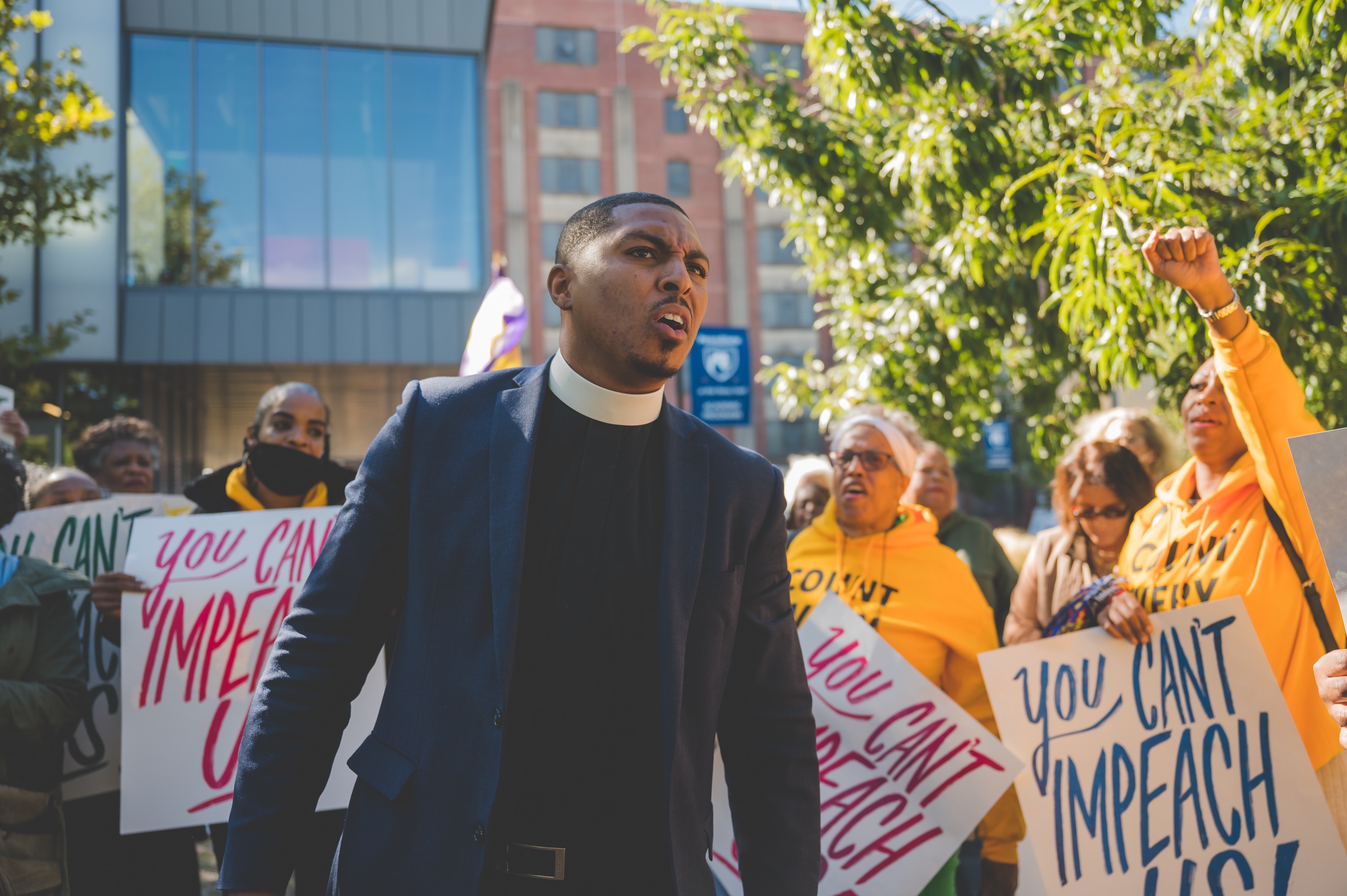 pastor nic o'rourke looks off into the distance at the rally