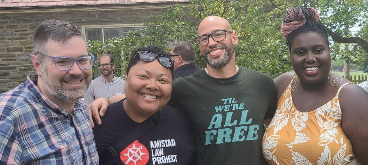 Kris, Nikki and Wispy of Amistad Law Project pose with Felix 'Phill' Rosado