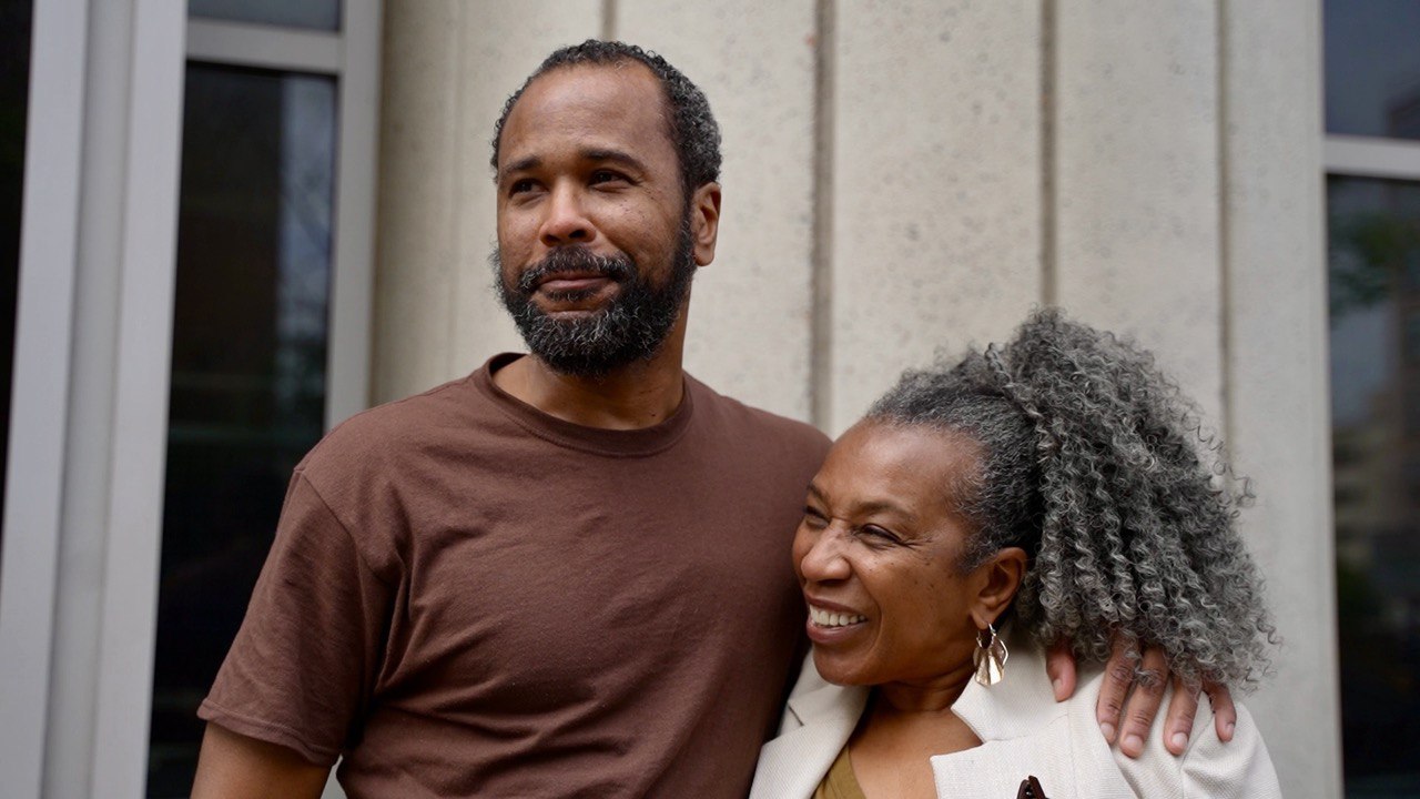 Shakaboona smiles with his arm around his mother Patricia Vickers who is also smiling