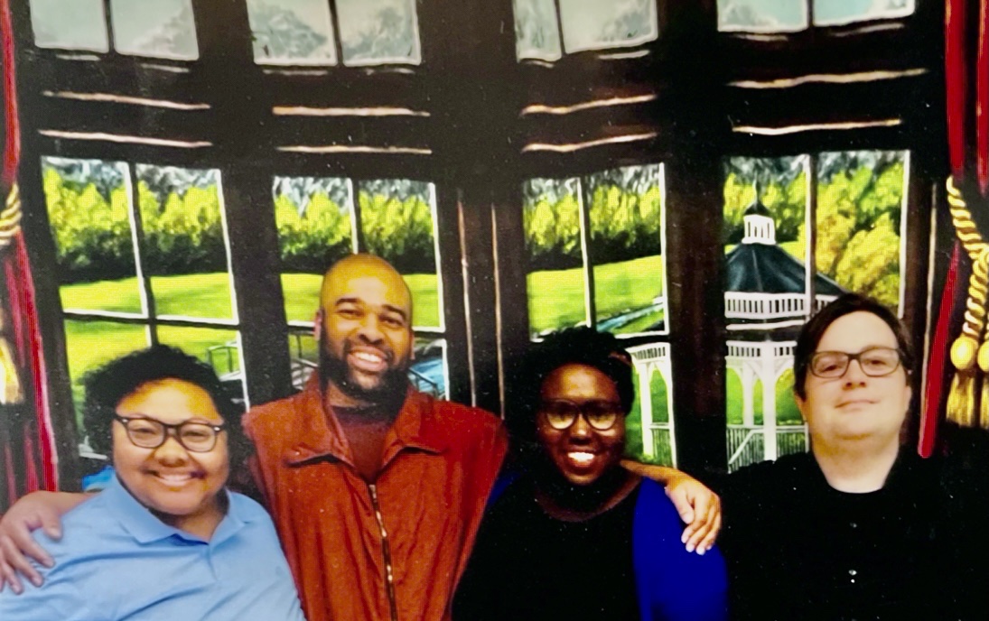 Darrick Hall and members of Amistad Law Project pose together for a photo on the occasion of the first visit where they weren't separated by a plexiglass barrier. 