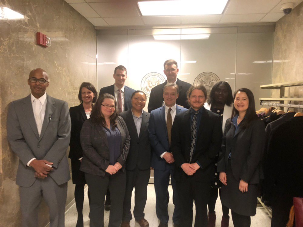 Attorneys with Amistad Law Project stand with lawyers from ACLU of PA, PA Institutional Law Project and Schnader Harrison Segal & Lewis