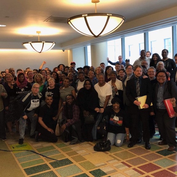 Lawyers from Amistad Law Project stand with a crowd of supporters at Kerry Marshall's resentencing