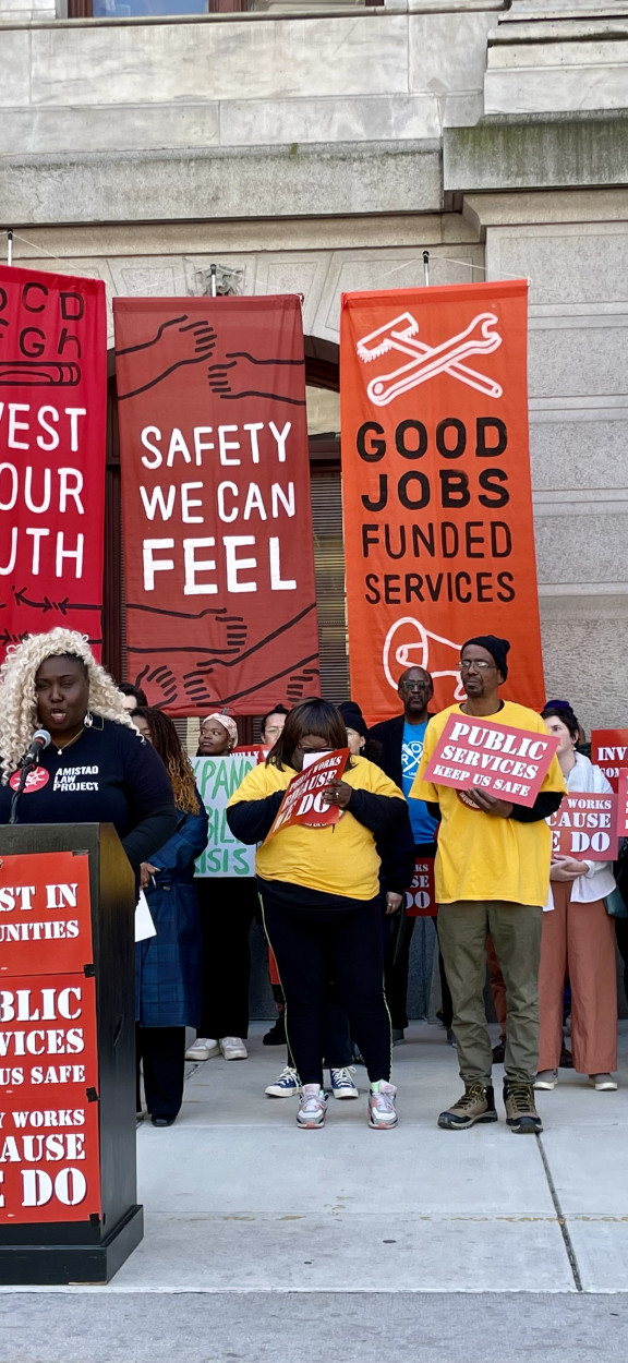 Nikki Grant speaks at a rally at City Hall