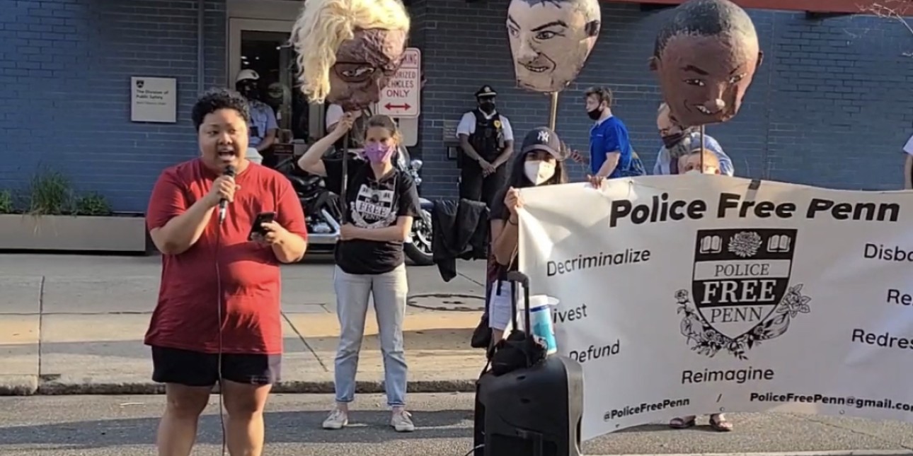 VIDEO: Kris Henderson speaks in front of the University of Pennsylvania police station next to people holding a banner that reads Police Free Penn