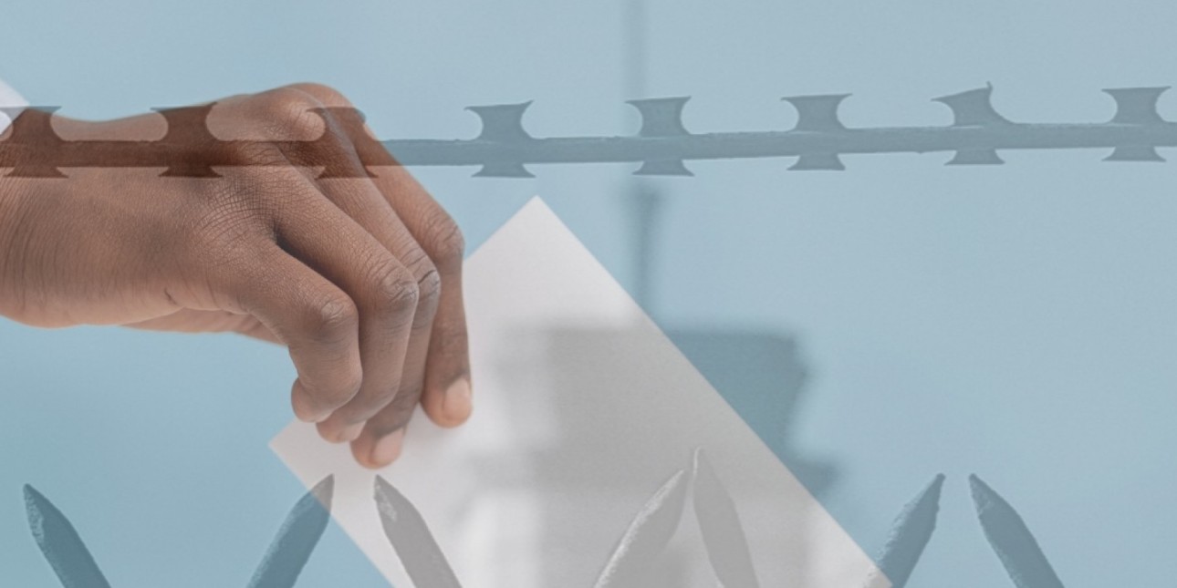 an image shows a Black person's hand putting a ballot into a ballot box juxtaposed with barbed wire