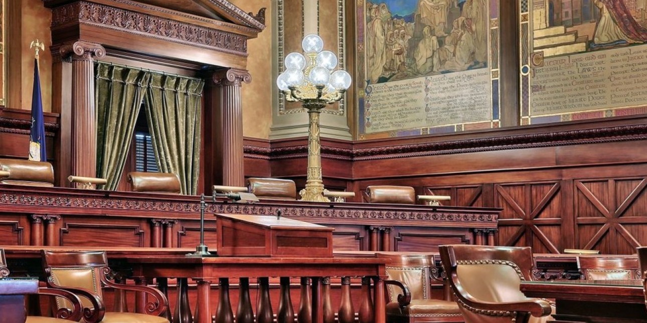 an image shows the empty seats in the PA Supreme Court where the Board of Pardons usually sits