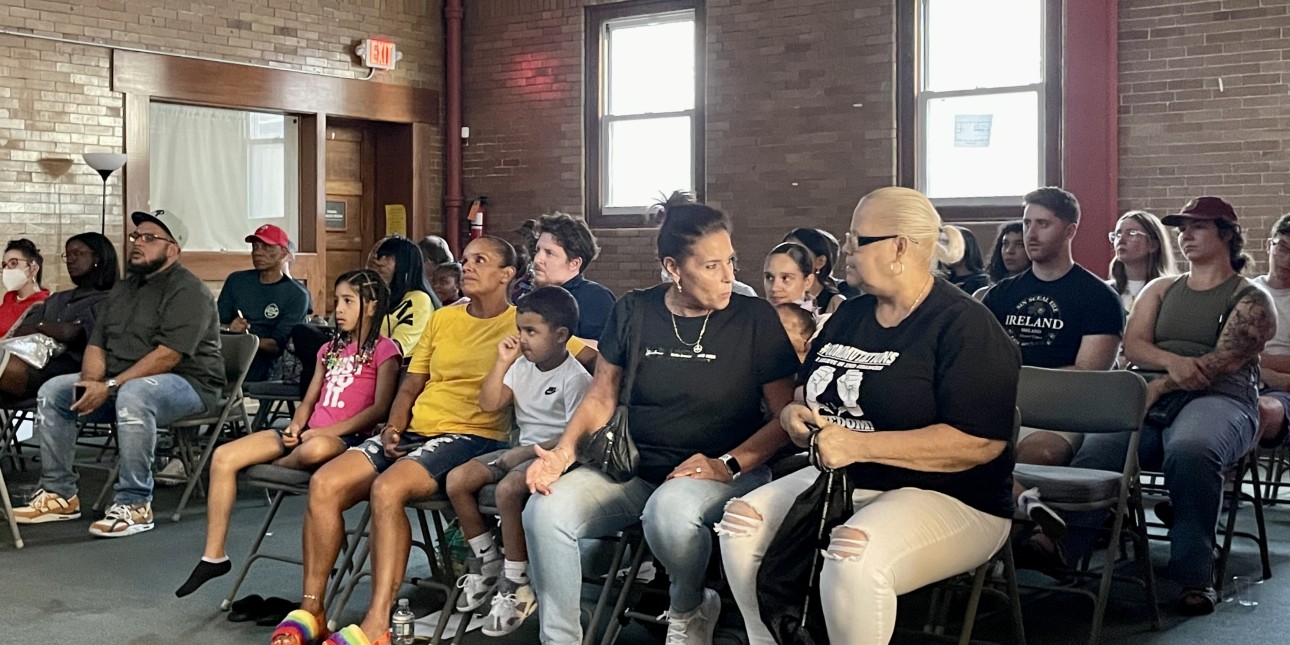 An audience watches No Way Home on a screen at the front of mosaic community  church 