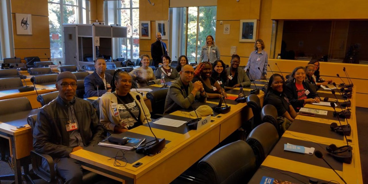 movement leaders are seated at desks for informal hearings with UN committee members