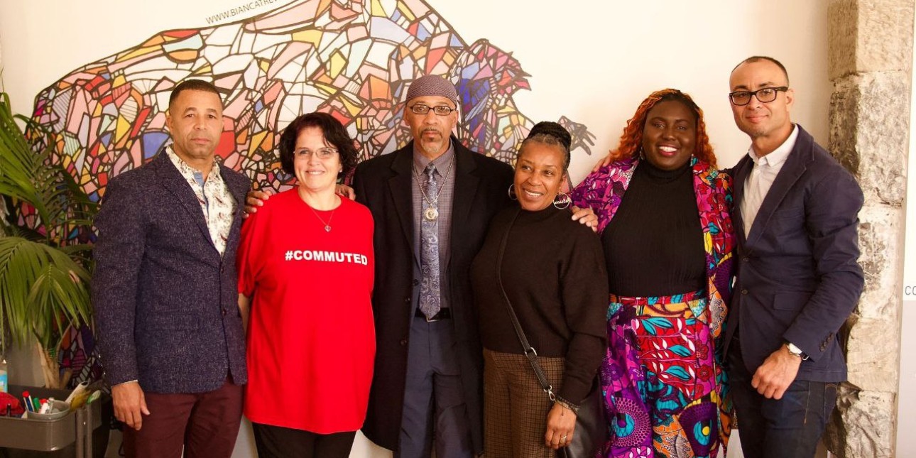 People impacted by death by incarceration and advocates stand for a photo after hearings at the united nations office in geneva