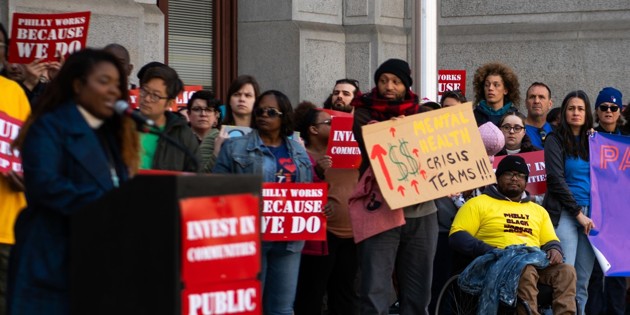 Members of unions and community groups rally for a people's budget