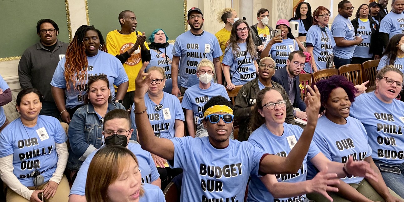 Community members wear shirts that say Our Philly, Our Budget