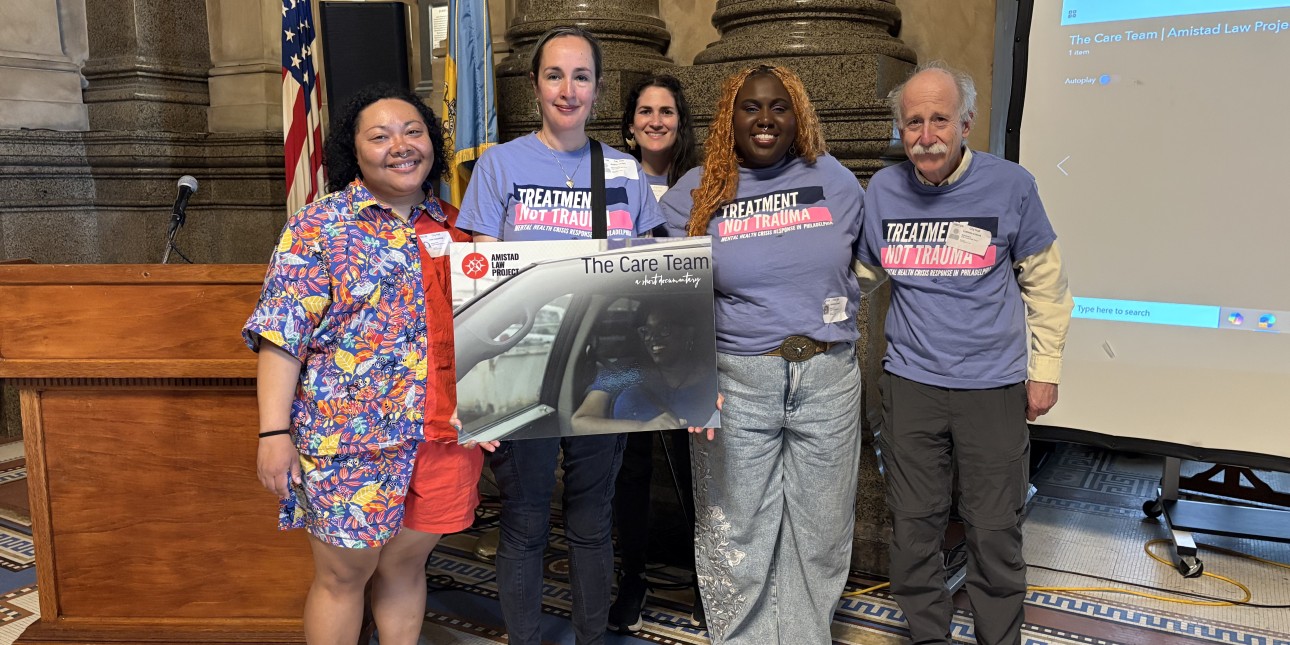 Members of Philadelphia Treatment Not Trauma hold Care Team poster