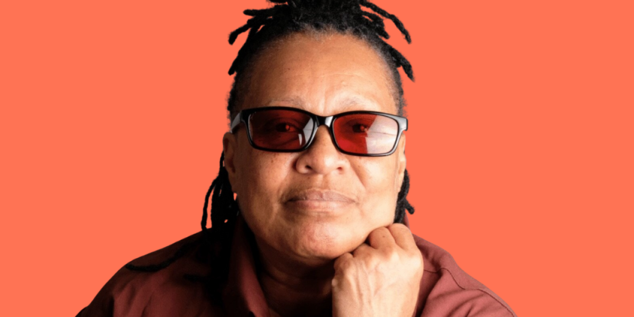 Mechie with her chin resting on her fist