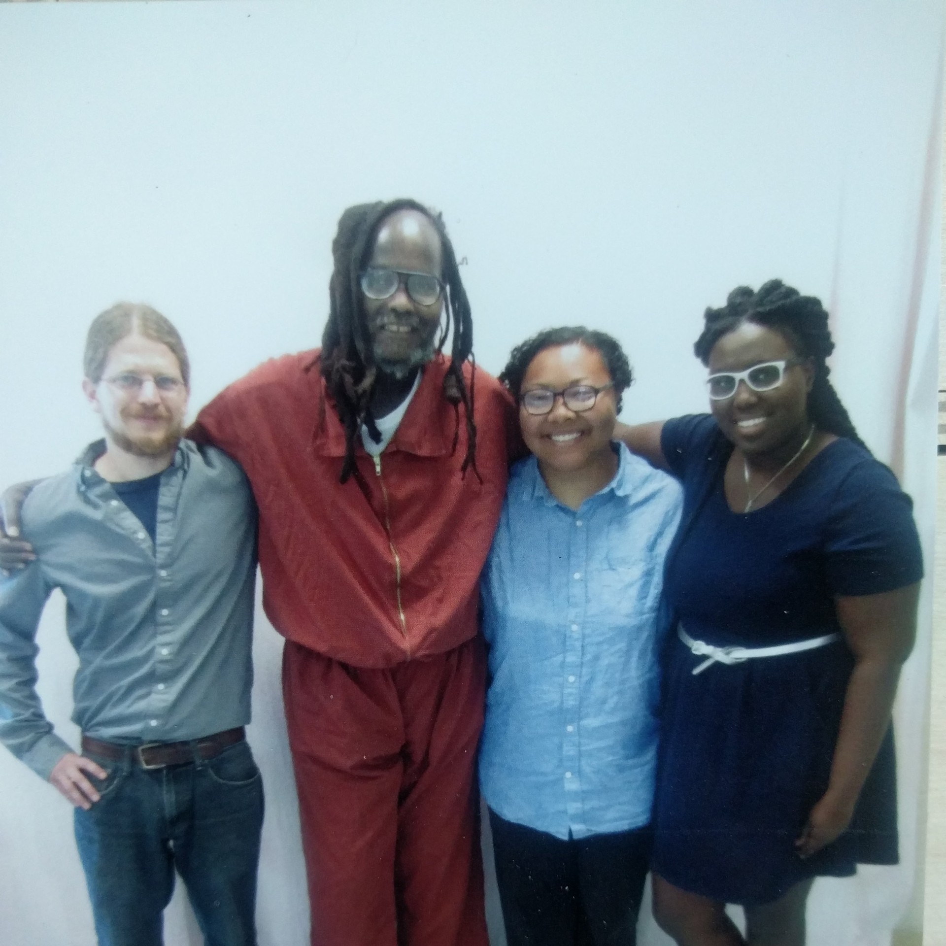 Mumia Abu Jamal and members of Amistad Law Project and Abolitionist Law Center post together