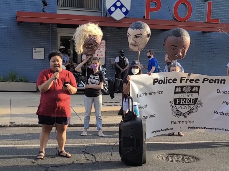 VIDEO: Kris Henderson speaks in front of the University of Pennsylvania police station next to people holding a banner that reads Police Free Penn