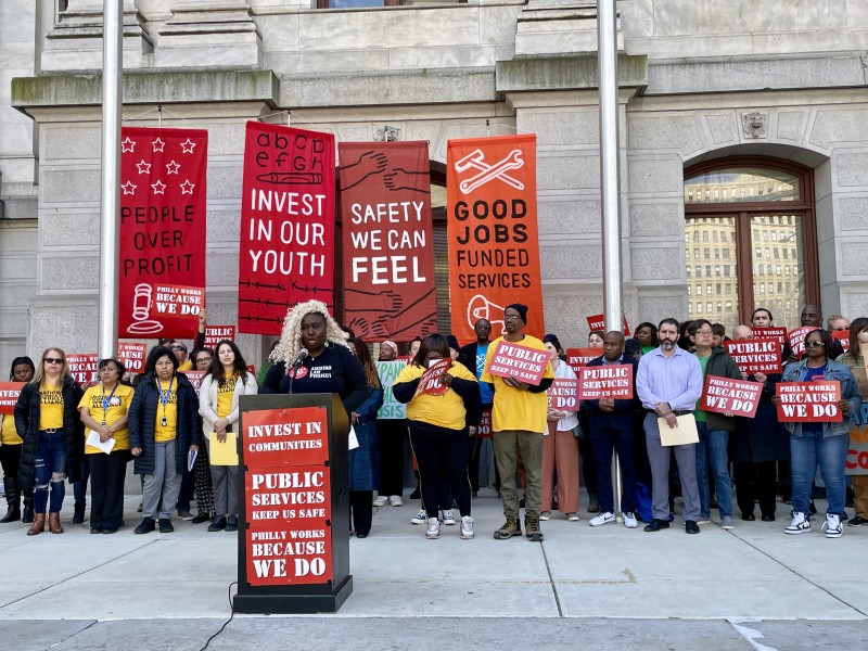Nikki Grant speaks at a rally in front of City Hall
