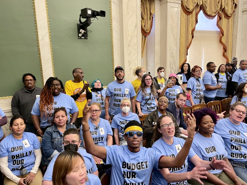 Community members wear shirts that say Our Philly, Our Budget