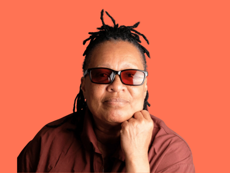 Mechie with her chin resting on her fist