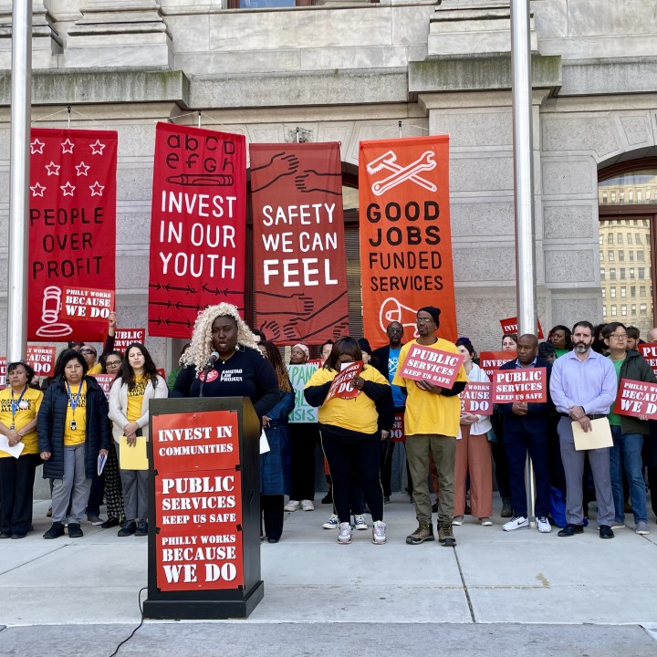 Nikki Grant speaks at a rally in front of City Hall