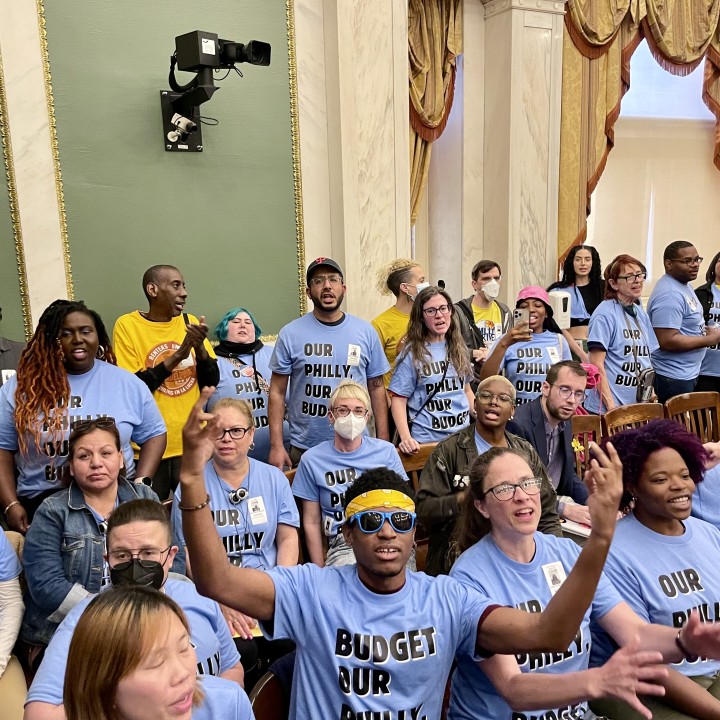 Community members wear shirts that say Our Philly, Our Budget
