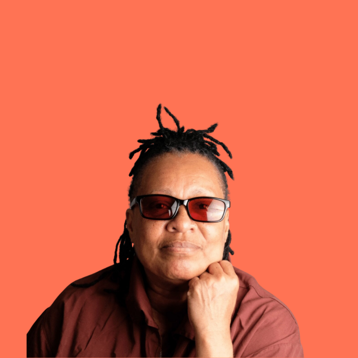 Mechie with her chin resting on her fist